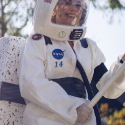 woman wearing a white and blue astronaut costume
