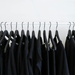 black clothes hanged in rack